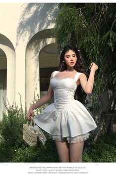 a woman in a short white dress holding a basket