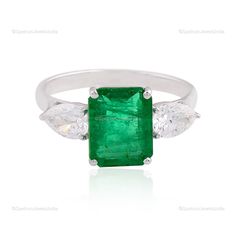 "A perfect blend of classy and elegant design Ring featuring 18k White Gold with Zambian Emerald. This is must to provide you an eye-catching attention. ✧✧Welcome To Our Shop Spectrum Jewels India✧✧ \"\"18k White Gold Natural Brilliant Cut Zambian Emerald Diamond Ring, Beautiful Bridal Statement Halloween Gift Ring, Anniversary Gift For Wife\"\" ★PRODUCT SPECIFICATION★ * ITEM CODE - SER-2199D * METAL - 18k White Gold * 18k White Gold Weight : 2.76 gm  * GROSS WEIGHT - 3.39 gm Approx * MAKING - H Elegant Gia Certified Marquise Wedding Ring, Elegant Emerald Cut Three Stone Birthstone Ring, Classic Gemstone Rings In Diamond White, Classic Diamond White Gemstone Rings, Elegant Gia Certified Sterling Silver Rings, Elegant Gia Certified Diamond White Ring, Elegant Marquise Emerald Ring With Center Stone, Gia Certified Marquise White Gold Ring, Elegant Sterling Silver Emerald Three Stone Ring