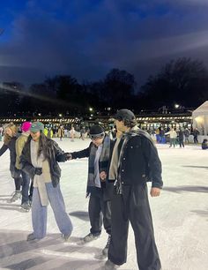 several people standing in the snow holding hands