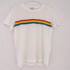 - Project Social T - White Lightweight Shirt - Rainbow Stripe On Front - Front Is A Little Shorter In Length Than The Back - Split On Sides Of The Bottom, Separating The Front And Back - Very Comfortable And Casual - Brand New, Never Worn - Great Condition White Graphic Tee With Rainbow Print, Rainbow Graphic Print Tops For Summer, Rainbow Graphic Print Top For Summer, Casual Rainbow Cotton Tops, Trendy White Tops With Rainbow Print, Summer Rainbow Graphic Print Tops, Trendy White Top With Rainbow Print, Trendy White Rainbow Print Tops, Cotton Pride Graphic Print Tops