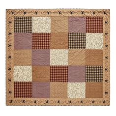 a brown and black patchwork quilt with stars on it