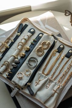 an assortment of jewelry sitting on top of a table