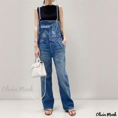 Olivia Mark - Vintage Multi-Pocket Workwear Overalls with Straight-Cut Leg, Split Hem, and Denim Straps. High Rise Denim Jumpsuit With Pockets In Utility Style, Utility Denim Blue Jumpsuit With Side Pockets, Blue Utility Jeans With Welt Pockets, Utility Washed Blue Denim Jumpsuit With Pockets, Utility Denim Jumpsuit In Washed Blue With Pockets, Washed Blue Workwear Jeans, Utility Overalls In Washed Blue With Pockets, Washed Blue Jeans With Pockets For Work, Utility Style Medium Wash Denim Jumpsuit With Side Pockets