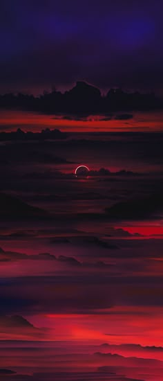 the sun is setting over some clouds in the night sky with red and purple hues