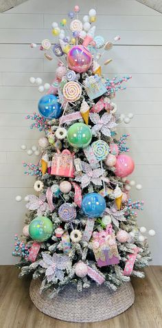 a decorated christmas tree with lollipops and candy