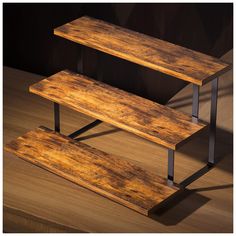 two wooden benches sitting on top of a wooden floor