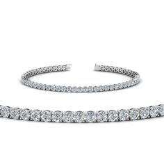 This Tennis Diamond Bracelet (4 Carat) portrays a magnificent elegance with the small glittering round shaped diamonds augmenting a radiant glow and aligned in a marvelous basket prong setting amplifying your beauty and personality aesthetically.  Round cut diamonds of 3.72 Total Carat Weight with Clarity SI2 and Color G in a prong setting. Total Number Of Stones:- 62 The diamond bracelet can also be customized with various gemstones and metals of your desire. Free Shipping Within USA. Direct manufacturing price. Easy Returns and Financing Available. Have a glimpse of the genuine customer reviews provided by our satisfied customers. Purchase your jewelry at source price, liberated from broker charges, trader charges, wholesalers or retailers charges. Professionals of the medical Dazzling White Gold Bracelet With Pave Setting, Luxury Diamond Bracelet With Pave Setting, Luxury Round Cut Diamond Bracelet With Pave Setting, Dazzling Platinum Diamond Bracelet With Single Cut Diamonds, Exquisite Platinum Diamond Bracelet With Brilliant Cut, Exquisite Platinum Bracelets With Brilliant Cut, Exquisite Platinum Bracelet With Brilliant Cut, Exquisite Platinum Tennis Bracelet With Diamond Accents, Luxury Diamond Bracelet With Brilliant Cut