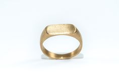 "Classic style handmade Signet 9k Gold Ring For Women or Men When the seal is made of K9 gold with brushed polishing in a matte shade. The ring is classic, has clean lines, and is light and comfortable to wear  ITEM DETAILS: Made of 9k solid Gold. The size of the rectangle pattern: 0.27/0.59\" ( 1.5/0.7 cm). Size in stock: 6,7,8,9 Size in photo US7 ✦ Gift box ✦ Ready to ship See more wedding rings in my shop: https://www.etsy.com/il-en/shop/batyas?ref=hdr_shop_menu§ion_id=21111855 Back to my shop: https://www.etsy.com/shop/batyas?ref=si_shop Thank you for stopping by, and have a great day :) JEWELRY CARE - Some important notes All jewelry needs special care - whether it is solid gold or silver, or metal plating. To Protect Overtime: * Avoid wearing jewelry while sleeping, working, or exerc Gold Matte Finish Jewelry Gift, Matte Finish Gold Jewelry Gift, Gold Signet Ring For Wedding, Gold Jewelry With Brushed Finish As Gift, Minimalist Hand Forged Signet Ring For Anniversary, Gold Signet Ring With Simple Design For Wedding, Minimalist Rings With Brushed Finish For Gift, Minimalist Rings With Brushed Finish As Gift, Classic Matte Finish Jewelry Gift