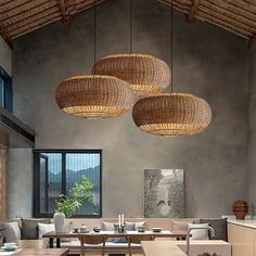 a dining room filled with lots of furniture and hanging lights over the top of it