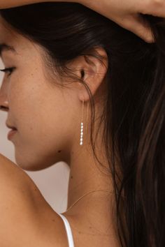 Inspired by Japan's famous female pearl divers, also known as Ama, which translates to "women of the sea", these freshwater pearl threaders float along your lobes with delicate beauty. A statement piece that's sure to become a regular in your earring rotation. Material Freshwater pearls 14k goldfill threaders Pearl bar measures 1" chain and post measure 3" Details Each piece of Leah Alexandra jewellery is handmade in her Vancouver beachside studio. Only the finest materials are used, including 1 Bags Inside, Bridesmaids Nails, Wedding Gift Guide, Curated Wedding, Crosses Decor, Delicate Beauty, Jewelry Style, Body Lotion, Fresh Water