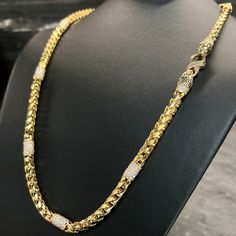 Discover the epitome of luxury with our UNRIVALED 10 carat diamond-paved, diamond-cut Franco chain, meticulously crafted with an upgraded diamond version of our Signature Lion & Snake Clasp. This 6mm men’s gold chain features nine pave’-diamond stations, pave’-diamond collars, and dazzling diamonds set in the lions’ eyes on the two lion head end caps. Stamped with the quality hallmark, this Franco chain guarantees exceptional craftsmanship and durability. Its diamond-cut design adds a captivatin Luxury Cubic Zirconia Chain Link Jewelry, Mens Diamond Chain, Formal Cuban Link Jewelry With Cubic Zirconia, Formal Cuban Link Cubic Zirconia Jewelry, Elegant Cuban Link Jewelry With Diamond Accents, Elegant Gold Cuban Link Necklace With Cubic Zirconia, Luxury Cuban Link Chain Necklace For Formal Occasions, Fine Jewelry Diamond Cuban Link, Elegant Cuban Link Necklace Diamond Cut For Gift