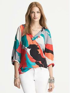 Printed Pleat Neck Blouse Modern V-neck Blouse For Fall, Modern V-neck Blouse For Spring, Multicolor Half-sleeve Blouse For Fall, Chic Multicolor Top With Split Neck, Chic Multicolor Split Neck Tops, Modern Multicolor Tops For Work, Chic Multicolor Split Neck Blouse, Multicolor V-neck Blouse For Work, Multicolor V-neck Workwear Blouse