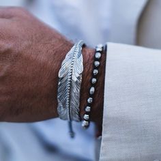 Wrist Size: Medium Material: Silver Plated 316L Stainless Steel Origin: California, USA   The Jovian & Feather Silver bracelets are handcrafted in 316L marine grade stainless steel, which is sterling silver plated and intricately etched for both texture and definition. Both bracelets complement each other handsomel Mens Jewelry Bracelet Silver, Aegean Blue, White Guy, Feather Bracelet, Art Of Man, Mens Necklace, Velvet Jewelry, Silver Feather, Fake Tattoos