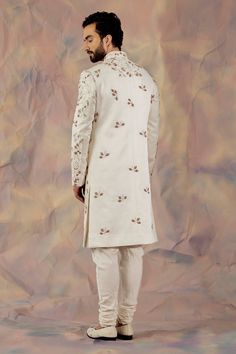 White hand embroidered sherwani with zardozi and aari in floral motifs. Paired with matching pintuck kurta and churidar.
Component: 3
Pattern: Embroidered
Type Of Work: Floral
Neckline: Mandarin
Sleeve Type: Long
Fabric: Linen Silk
Color: White
Other Details: 
Floral motifs
Occasion: Groom,Wedding - Aza Fashions Designer Embroidered Sherwani For Festivals, Designer Wedding Sets With Floral Embroidery, Wedding Sherwani With Floral Embroidery In Traditional Drape, Wedding Sherwani With Floral Embroidery And Traditional Drape, Wedding Sherwani With Floral Embroidery, Designer Raw Silk Sherwani With Intricate Embroidery, Designer Sherwani With Intricate Embroidery In Raw Silk, Traditional Sherwani With Floral Embroidery For Festivals, Designer Sherwani With Floral Embroidery