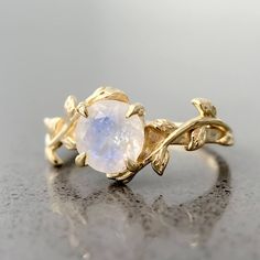 This leaf moonstone ring is intricately designed in 14k gold plating over sterling silver. It is a very unique piece just like the person wearing it! Moonstone is considered to be a stone of "New Beginnings". It can help you stabilize your emotions and enhance your intuition. Ethereal Moonstone Crystal Ring For Wedding, Nature-inspired Moonstone Ring As Gift, Silver Moonstone Ring With Nature-inspired Style, Nature-inspired Moonstone Wedding Ring, Leaf Moonstone Ring, Magical Jewelry, Healing Jewelry, Crystal Shop, Moonstone Ring