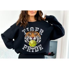 This makes the perfect vintage school spirit Tigers Softball sweatshirt! This tigers sweatshirt is great for showing your school spirit! This distressed vintage tiger and softball design is perfect on the popular Gildan brand sweatshirt. This vintage style sweatshirt will keep you warm throughout the softball season!  A pre-shrunk, classic fit sweater that's made with air-jet spun yarn for a soft feel and reduced pilling. ** P R O D U C T **  - 50% cotton, 50% polyester  - Pre-shrunk  - Classic fit  - Direct to Garment print (no stencils or vinyl which means it will last a lot longer)   - Printed and Shipped in the USA  - Due to different monitor screens colors may vary ** S I Z I N G **  - Consult size chart in listings for measurements  - Sizing is Unisex for all tees, runs true to size Sweatshirt Design Ideas, Softball Sweatshirt, Tiger Mascot, Game Day Sweatshirt, Softball Mama, Mascot Shirt, Softball Season, Booster Club, Softball Shirt