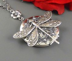 "This steampunk inspired large necklace is 30\" long. Large round sterling silver plated locket is embellished with snowflake antique silver finished filigree . I have set large antique silver finished dragonfly on top of stamping. Pendant is hanging from antique inspired silver floral link, silver chain and silver lobster clasp. Locket is 38 mm in size. Thanks for looking, Mani Please note: I DO NOT DO ENGRAVING OR INSERT PICTURES!" Locket Necklace Silver, Locket Vintage, Daughter Wedding Gifts, Large Locket, Personalized Gold Necklace, Silver Locket Necklace, Engraved Locket, Gold Heart Locket, Gold Locket Necklace