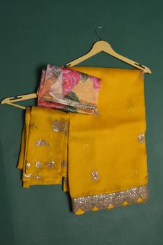 Be a vision of elegance at weddings and parties in this mango yellow embroidered organza sari. It comes with a matching and multicolor blouse piece. Shop designer sarees online in USA from Pure Elegance. DISCLAIMER:- The shown stitched blouse on the model is for display purpose only. The saree comes with a matching blouse piece and finished with fall and piko. Yellow Tissue Silk Pre-draped Saree For Navratri, Yellow Semi-stitched Chanderi Pre-draped Saree, Yellow Silk Salwar Kameez With Gota Work, Yellow Georgette Pre-draped Saree With Pallu, Yellow Silk Sharara With Dupatta, Yellow Dola Silk Pre-draped Saree For Navratri, Yellow Tissue Silk Sharara For Eid, Yellow Tissue Silk Salwar Kameez For Navratri, Navratri Yellow Tissue Silk Salwar Kameez