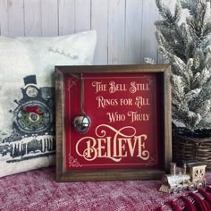 the bell still rings for all who truly believe christmas ornament in a wooden frame