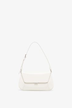 White leather bag from Amina Muaddi. The Ami mini bag is made of calf leather with silver finish hardware, a magnetic closure along with an inside mirror frame. It features an internal flat pocket and is complete with an adjustable strap.Measurements: L21 x H12 x W4 cmMade in Italy Luxury White Baguette Bag With Removable Pouch, Luxury White Baguette Bag With Top Handle, Timeless White Flap Bag For Evening, Luxury White Satchel Baguette Bag, Luxury White Crossbody Baguette Bag, Luxury White Baguette Crossbody Bag, Chic Leather Baguette Bag With Silver-tone Hardware, Classic Leather Baguette Bag With Silver-tone Hardware, Timeless White Rectangular Flap Bag