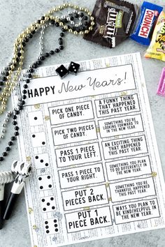 a new year's resolution card next to candy bar wrappers and other items