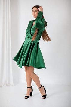 "Feel effortless in our Emerald green mini Silk Dress. Made from a luxurious silk -viscose mix, this dress is designed with a flattering V neckline, button cuffs  sleeves to create a delicate balloon style, this dress is finished with a self tie ballon style sleeves  Collar Style V-Neck Tie Fastening Silk viscose mix  Fabric-65% silk,35 % viscose  Our model wears size S and she is 175cm (5′9″). ✽ All our items are made-to-order, not mass produced. Please choose your sizes and details carefully before you place your order.  Custom size available, with no extra charge. Custom size will be shipped within 1 week and it is not refundable.  * custom sizes and colours are available (see drop-down menu) - if you select \"Custom Size\" option, please send us this information below; Bust- Under-bust Green Satin Midi Dress For Evening, Silk Mini Dress With V-neck For Evening, Green Satin Evening Dress For Summer, Satin Silk V-neck Dress For Party, Green Silk Satin Party Dress, Green Satin Cocktail Dress For Summer, Elegant Green Silk Cocktail Dress, Elegant Green Satin Party Dress, Green Mini Evening Dress