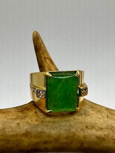 vintage green fun jade ring  Setting is a golden finished bronze setting  This is one of my hand re finished treasures. Salvaged from vintage.  Size   9.5 Re sizing can be done for a $20 fee and may take up to a week.  Engraving is $4 per letter.  Thank you for supporting a veteran's small business. All jewelry is shipped free within the US in a stylish gift box  PLEASE NOTE If we have multiples of the same vintage item, it is because we often purchase factory remnants or odd lots. Likewise, if Vintage Jade Rings For Formal Occasions, Antique Green Ring Jewelry, Vintage Green Gemstone Jewelry, Vintage Rectangular Emerald Ring Gift, Heirloom Green Jade Rings, Vintage Jade Rings For Anniversary, Vintage Green Rings With Stone Setting, Vintage Green Rings For Collectors, Vintage Handmade Green Emerald Ring