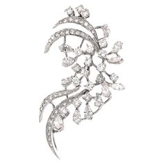 Introducing an exquisite piece of jewelry that seamlessly blends elegance and versatility: a pendant cum brooch adorned with a stunning array of diamonds. This masterpiece features 5.36 carats of dazzling white round diamonds, complemented by 12 sparkling white marquise diamonds totaling 1.85 carats. Expertly crafted in 18k white gold, it weighs 10.68 grams, ensuring a perfect balance of luxury and comfort. Whether worn as a pendant or a brooch, this beautiful piece radiates sophistication and charm, making it an essential accessory for any occasion. Its timeless design and brilliant sparkle will elevate any outfit, making you the center of attention at every event. Indulge in the unparalleled beauty and craftsmanship of this pendant cum brooch, a true testament to fine jewelry artistry. Elegant Diamond White Brooch Jewelry, Luxury White Elegant Brooches, Luxury Diamond White Brooch With Brilliant Cut, Luxury Diamond White Brooch, Exquisite White Gold Pendant Brooch, Luxury Diamond Pendant Brooch, Diamond Hair, Ruby Pendant, Rose Pendant