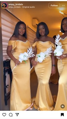 three beautiful women in yellow dresses posing for the camera with white flowers on their bouquets