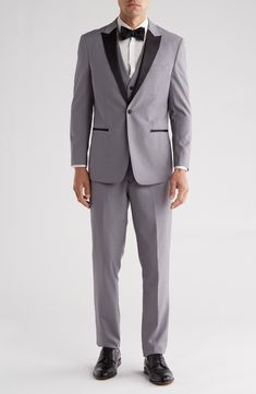 Bring understated elegance to the table in this three-piece tuxedo crafted from rich fabric in a classic single-breasted silhouette. Jacket has shawl collar; chest welt pocket; front welt pockets Vest has front button closure; V-neck Pants have zip fly with button closure; front slant pockets; back button-welt pockets Jacket and vest are lined; trousers are lined to the knee 65% polyester, 35% viscose Dry clean Imported Each suit has a 6” drop, meaning that a size 38R jacket is paired with size Fitted Tuxedo Sets For Parties, Slim Fit Tuxedo Three-piece Suit For Party, Tailored Tuxedo Three-piece Suit For Party, Slim Fit Notch Lapel Party Sets, Tailored Sets For Black-tie Events, Evening Tuxedo Sets, Slim Fit Tuxedo Style Three-piece Suit, Fitted Tuxedo Three-piece Suit For Party, Elegant Slim Fit Formal Sets