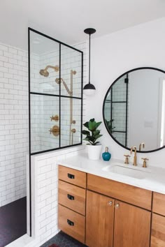 a bathroom with two sinks and a large mirror