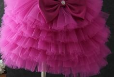 Playful Design: Features multiple layers of soft tulle for a voluminous and fun look. Comfortable Fit: Designed with a fitted bodice and a flattering silhouette. Perfect for Parties: Ideal for birthdays, parties, and other special occasions. Twirl-Worthy: The tulle layers create a skirt that's perfect for twirling. High-Quality Material: Made from soft, durable tulle for lasting wear. Available Sizes: Offered in various sizes to fit girls of different ages. Versatile Style: Suitable for a range Pink Tulle Skirt Ball Gown For Dress-up Events, Pink Tulle Ball Gown For Dress-up, Pink Tulle Ball Gown For Dress-up Events, Tiered Ruffle Princess Dress For Dress-up, Tiered Princess Dress With Ruffles For Dress-up, Pink Tulle Ball Gown For Summer, Summer Pink Tulle Ball Gown, Princess Style Tutu Dress With Ruffles For Wedding, Spring Fancy Dress Tulle Ball Gown