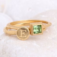 "We love pairing this sweet sentiment of an initial and a birthstone. Perfect for the mother or grandmother of one, or to represent your own initial and birthstone! Also makes a great graduation gift. **This listing is for two 24K gold vermeil rings, one initial ring and one birthstone ring. Each ring has either one letter or one birthstone.** Want more than 2 rings in your stack? Create your own set at this listing: https://www.etsy.com/listing/230748928 These rings are also available in SILVER May Birthstone Stackable Rings With Bezel Setting, Gift Stackable Rings With Bezel Setting For May Birthstone, Stackable Bezel-set Rings For May Birthstone Gift, Mother's Day 14k Gold Stackable Rings, Adjustable Stackable Initials Rings As Gift, Adjustable Stackable Rings With Initials For Gift, May Birthstone Stackable Birthstone Ring, Stackable Gemstone Rings For Anniversary, Stackable Initial Ring For Anniversary