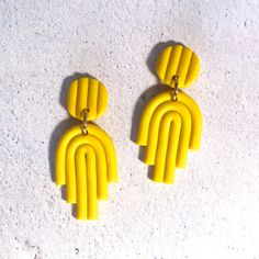 Yellow Earrings - #782 Lightweight - 2.9g each Unique, Handmade 4cm long - measured from piercing 2cm wide Titanium Posts - Loved by the most sensitive ears Beautiful buttery yellow, textured polymer clay stud earrings Front has a textured, matte finish Back has a different,  lightly textured, matte finish Colours may vary slightly depending on device used Titanium Posts and Comfort Backs Earrings can be changed to hooks if so desired at no extra cost.  There are many co-ordinating colours to choose from.  Hooks in anodised aluminium and niobium.    Contact me when purchasing with your choice of type and colour Earrings arrive gift boxed ready for giving or a beautiful gift for yourself