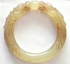 Antique-18-9th-Century-Chinese-White-Jade-Dragon-with-Ball-Small-Bangle-Bracelet Elegant Adjustable Carved Bangle, Antique Carved Bangle Jewelry, Carved Bangle Jewelry For Wedding, Luxury Engraved Jade Jewelry, Jade Bracelet For Wedding, Luxury Collectible Round Bangle, Formal Intaglio Bangle Jewelry, Ceremonial Carved Bangle Jewelry, Carved White Bracelet Jewelry