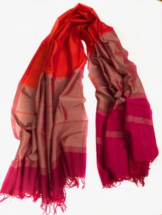 HANDMADE RAW SILK SCARF/ SHAWL  EACH PRODUCT IS UNIQUE AND ONE OF A KIND.  These scarves are made in Sri Lanka and are a product of hand looming, which is a traditional art carried through generations in Sri Lanka.  Yes, these beautiful products are made completely by hand and processed naturally. Red Bollywood Cotton Silk Dupatta, Fitted Red Cotton Silk Dupatta, Red Cotton Silk Dupatta With Traditional Drape, Fitted Red Tussar Silk Dupatta, Red Cotton Silk Dupatta For Festivals, Traditional Red Cotton Silk Dupatta, Red Tussar Silk Dupatta, Fitted Red Silk Dupatta, Traditional Red Scarves For Festivals