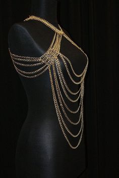 Here's a great and totally unique body chain necklace that makes the old 'little black dress' take on a whole different meaning! This gold body chain as I like to call it, adds the perfect amount of deco to your once all too simple party dress. It also looks great worn over a loose shirt, with jeans, conforming to the body in all the right places. Its great for a cocktail party or a night out at the clubs, this is definitely an attention grabbing piece. Would you like to see more body chain jewe Festival Clavicle Chain Necklace, Gold Bohemian Body Chain For Festivals, Bohemian Gold Body Chain For Festivals, Gold Adjustable Body Chain For Festivals, Gold Body Chain With Adjustable Chain For Festivals, Adjustable Delicate Chain Body Jewelry For Festival, Choker Chain Jewelry For Night Out, Gold Body Jewelry With Adjustable Chain For Festivals, Bohemian Clavicle Chain Body Jewelry