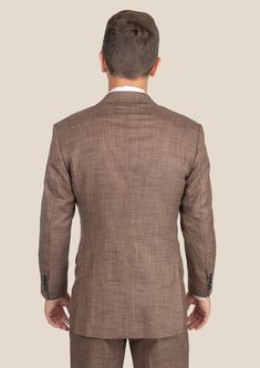 Be the best dressed at your next event with the Tawny Brown Hopsack Suit. This cool and stylish suit exudes elegance and luxury. Custom made from a luxurious bamboo/wool/linen/silk blend from Cavani, you're guaranteed to look as good as you feel. Dress to impress with this must-have suit. Luxury Linen Tweed Jacket With Notch Lapel, Luxury Linen Tweed Jacket For Business, Tailored Luxury Linen Blazer, Luxury Tailored Linen Blazer, Luxury Linen Business Tweed Jacket, Elegant Linen Blazer With Concealed Placket, Luxury Linen Tweed Jacket For Business Casual, Single Breasted Linen Office Suit, Linen Single-breasted Suits For Office