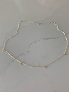 This 14K Gold MAMA Necklace is a beautiful, handcrafted piece of jewelry ideal for everyday wear. It is crafted exclusively in 14K yellow gold and can be combined with other necklaces for a layered look. Perfect for any special occasion like Valentine's Day, Mother's Day, Birthdays, Anniversaries and Christmas.♦ Materials: 14K Yellow Gold♦ Available colors: Yellow Gold♦ Necklace measurements: 16"-18" inches♦ Letters Measurement: 5MM height--------------------------------------------------------- Luxury Sterling Silver Charm Necklace For Everyday, Silver Custom Necklace In Dainty Style, Dainty 14k Gold Necklace In Silver Color, Dainty 14k Gold Custom Necklace In Silver, Minimalist Sterling Silver Custom Necklace, Minimalist Sterling Silver Necklace, Silver 14k Gold Initial Pendant Necklace, Dainty Sterling Silver Custom Necklace For Everyday, Hallmarked White Gold Necklace For Mom