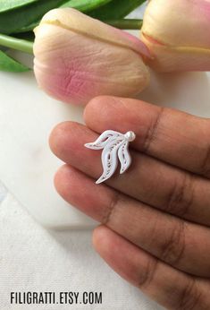 If you are the kind of person who loves minimalist modern jewelry with unique designs, then you must checkout these small stud earrings in an abstract feminine design. These white earrings are made of paper using the technique of paper quilling. They are more than just earrings, They are a work of art. #minimalistmodernjewelry #smallstudearrings #whiteearrings #abstractearrings #bestbridesmaidgifts #giftsforbestfriends Earrings Quilling, Quilled Earrings, Best Bridesmaid Gifts, Unique Studs, Quilled Jewellery, 30th Birthday Gift, Small Stud Earrings, Stud Earrings Unique, Quilling Jewelry