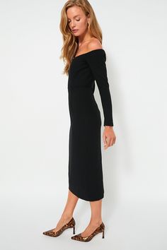 Exude elegance in the Alva Dress. This chic maxi boasts an off-the-shoulder neckline and fitted silhouette that creates a classy, sophisticated look. The zip closures at the wrists allows for a snug fit through the sleeves. Pair with silver or gold accessories and heels for black tie events, weddings, and formal dinner parties. Off-the-shoulder neckline Invisible back zip closure Long sleeves with zip closures at wrist Fitted silhouette Midi length Lined Material: 100% Polyester (outer), 97% Pol