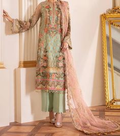 Brand New designer suit apple green with pink and yellow embroidery. Embroidered Net Shirt with silk lining. Plain Silk trousers. Embroidered Full size net duppatta. Dupatta 431/2 inch by 96 inches Shirt chest 21 inches, length 46 inches Trousers length 38 inches Green Anarkali Lawn Suit With Traditional Drape, Green Designer Anarkali Lawn Suit, Green Churidar With Resham Embroidery And Long Sleeves, Green Chikankari Embroidery Churidar In Jamawar, Green Embroidered Unstitched Suit With Long Sleeves, Green Embroidered Long Sleeve Unstitched Suit, Elegant Green Embroidered Churidar, Green Long Sleeve Churidar With Resham Embroidery, Elegant Green Jamawar Salwar Kameez