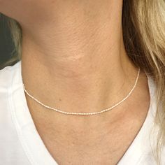 "A tiny natural Pearl beads choker necklace. Perfect as a gift for someone you love or even for yourself for birthday gift or any other special occasions like Christmas gift, Mother's day gift, Valentines day gift, a wedding, or the celebration of an anniversary. ► Please check our Add-on section to add name disc and turn your jewelry to a personal gift - https://www.etsy.com/listing/557860024/add-on-gold-filled-disc-sterling-silver?ref=shop_home_active_3&frs=1 ------------------------------ Beads Choker Necklace, Pearls Choker, Beads Choker, Gift Valentines Day, Pearl Choker Necklace, Necklace Minimalist, Beaded Choker Necklace, Natural Pearl, Layering Necklace