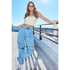 A pair of high-waisted wide-fit jeans featuring bottom strings to tie up, pin-tucked front line, straight cutouts on the knee area, a 5-Pocket construction, and zip-fly closure. This 99% cotton rigid denim can present perfect wide jeans fit. -Rise: 12.5", Inseam: 29.5" -Model is 5'9" and wearing a size M -True to size Trendy Wide Leg Cargo Jeans For Summer, Trendy High Waist Ripped Cargo Jeans, Trendy High-waisted Denim Blue Cargo Jeans, Trendy Spring Cargo Jeans With Belt Loops, High-waist Cargo Jeans With Belt Loops For Spring, Trendy High-waisted Cargo Jeans For Summer, High Waist Ripped Cargo Jeans For Spring, High Rise Cargo Jeans For Spring Streetwear, Trendy Ripped Cargo Jeans For Spring