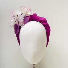 "FABRIC This Women's fascinator headband has been carefully handmade. The headband has been covered with a crepe silk with a pretty complementary organza silk hydrangea mount. Comfortable to wear and boasts a quality finish to ensure a luxurious, sustainable and top quality finish FIT  A flexible base band to fit all head sizes.  PACKAGING Each headband is wrapped in pretty acid free tissue paper, sealed with an Evierosemade brand sticker and shipped in an eco-friendly cardboard gift box to protect while in transit. If you are purchasing as a gift, please select \"This order is a gift\" (the item price will not be included in the gift box). If you would also like to add a personalised message to the recipient, please enter your message in the box marked \"Add a Note to evierosemade\". Plea Purple Handmade Flowers Headband, Purple Headband With Handmade Flowers, Elegant Fascinator With Structured Crown And Matching Headband, Headband For Garden Party At Royal Ascot, Structured Crown Headpiece For Royal Ascot, Royal Ascot Garden Party Headband, Evening Headpiece With Handmade Flowers And Pinched Crown, Spring Ceremony Headpiece Headband, Spring Ceremony Headpieces With Headband Shape