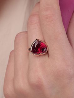 With its playful, symbolic vibe and juicy red color, this striking ring from our Simplicity Collection is a perfect addition to any modern collection. Large red heart shaped ruby is encased in meticulously hand finished band. This stunning ring will make a fun alternative to a traditional cocktail ring. Ruby 11mm x 12mm Follow us on Instagram: https://www.instagram.com/missionewyork/ Red Fine Jewelry Rings For Valentine's Day, Elegant Heart Shaped Rings For Parties, Valentine's Day Ruby Promise Ring, Red Heart Cut Ring As A Gift, Rose Gold Rings For Valentine's Day Party, Fine Jewelry Red Ruby Ring For Party, Red Heart Shaped Ruby Promise Ring, Ruby Heart Ring As Gift, Red Heart Ring For Proposal In Fine Jewelry Style