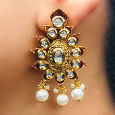 These are a beautiful pair of Earrings, made with beautifully Kundan beaded. These earrings work well with all types of clothing, whether it be formal attire or a casual party. Option 1: Red Color (E728) Option 2: White Color (E729) Eye-catching and unique jewellery that will set you apart. Gift this piece to a loved one, and see their face light up with joy. Best for gifting or for personal use, wear it to any occasion and be in the spotlight. Saree Jewellery, Silver Pooja Items, Glass Bangles, Silver Toe Rings, Ruby Beads, Gold Chain With Pendant, Kundan Earrings, Silver Anklets, Bridal Bracelet