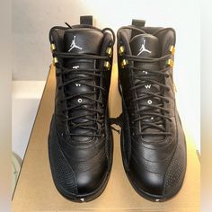 Brand New!! Nike Air Jordan 12 Retro Shoes In Black/White/Gold Modern Black Jordan Shoes With Rubber Sole, Modern Black Jordan Shoes With Contrast Sole, Black Leather Lace-up Jordan Shoes, Modern Black Lace-up Basketball Shoes, Black Jordan Shoes With Rubber Sole, Black Leather Basketball Shoes With Laces, Black Low-top Jordan Shoes With Laces, Black Low-top Jordan Shoes, Modern Black High-top Jordan Shoes