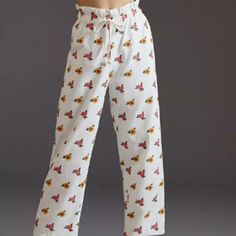 Farm Rio Cross Stitch Embroidered Pants Description: Wide Leg Cropped Pants With Front Drawstring. Color: White W/ Yellow Red Embroidered Floers Material: 100% Cotton White Floral Print Pants, White Floral Print Straight Pants, White Floral Print Bottoms With Relaxed Fit, White Floral Print Relaxed Fit Bottoms, White Floral Print Ankle-length Bottoms, White Floral Print Ankle-length Pants, Floral Embroidered Relaxed Fit Bottoms For Loungewear, White Floral Print Trousers, Casual Floral Embroidered Loungewear Bottoms