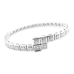 Authentic Cartier Tectonique 18k White Gold Diamond Tennis Bracelet       About Cartier: The company has a long and distinguished history of serving royalty, as well as stars and celebities. One Prince of Wales hailed Cartier as "Joaillier des Rois, Roi des Joailliers" (Jeweller to Kings, King of Jewellers"). Cartier received an order for 27 tiaras for the coronation of the future King. King Edward VII was crowned in 1902 and in 1904 he honoured the Company with the Royal warrant of supplier to Elegant Cartier Diamond Bracelet With 17 Jewels, Cartier Timeless Jubilee Bracelet, Elegant Cartier Diamond Jubilee Bracelet, Formal Cartier Fine Jewelry Diamond Bracelet, Cartier Diamond Bracelet Fine Jewelry For Formal Occasions, Cartier Diamond Bracelet For Formal Occasions, Formal Cartier White Gold Bracelets, Cartier White Gold Bracelets For Formal Occasions, Formal White Gold Cartier Bracelets